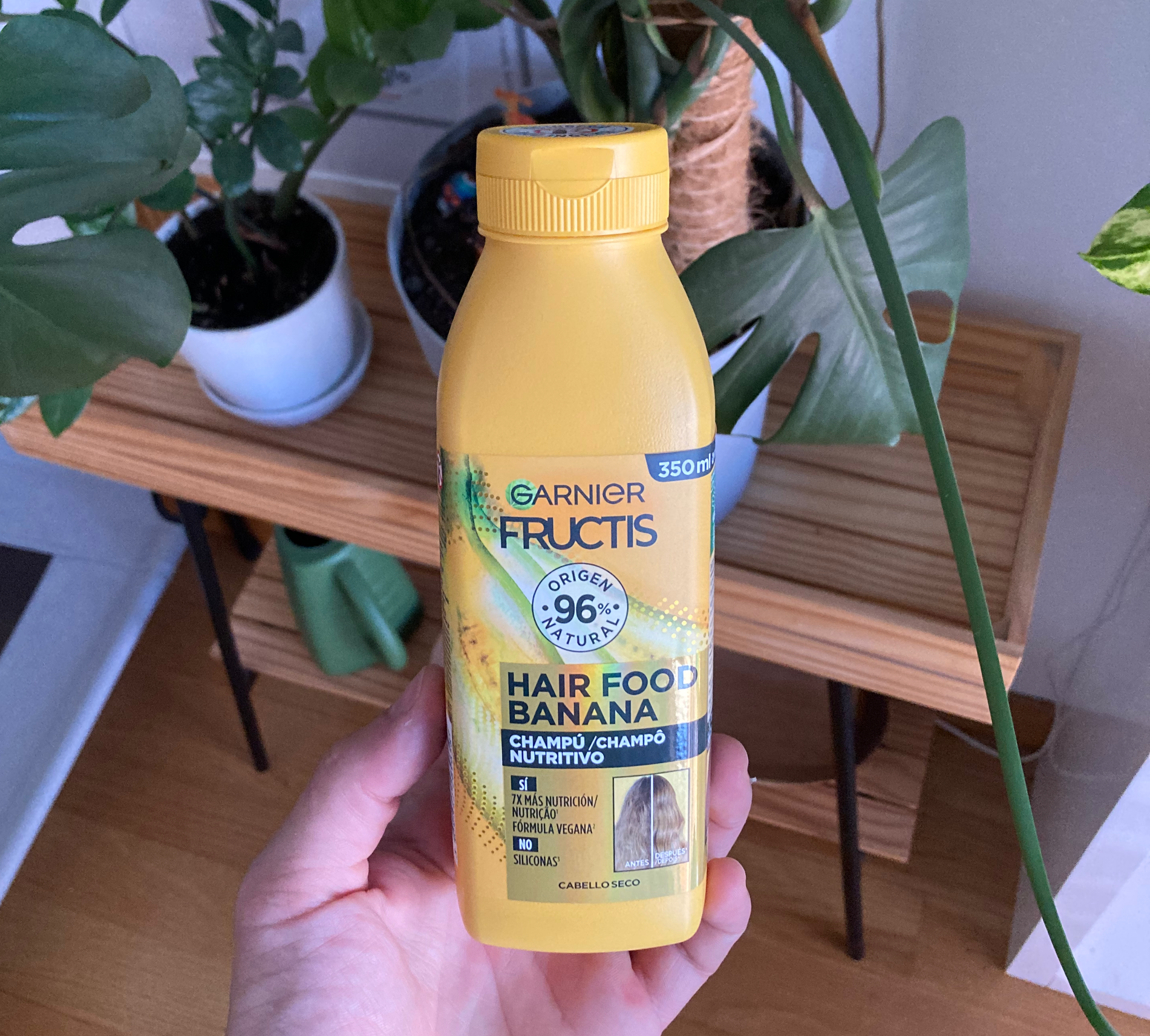 Picture of a yellow bottle, shaped like a smoothie from Lidl, with a big banana background where only a fraction of the packaging looks tells the user this is a hair product